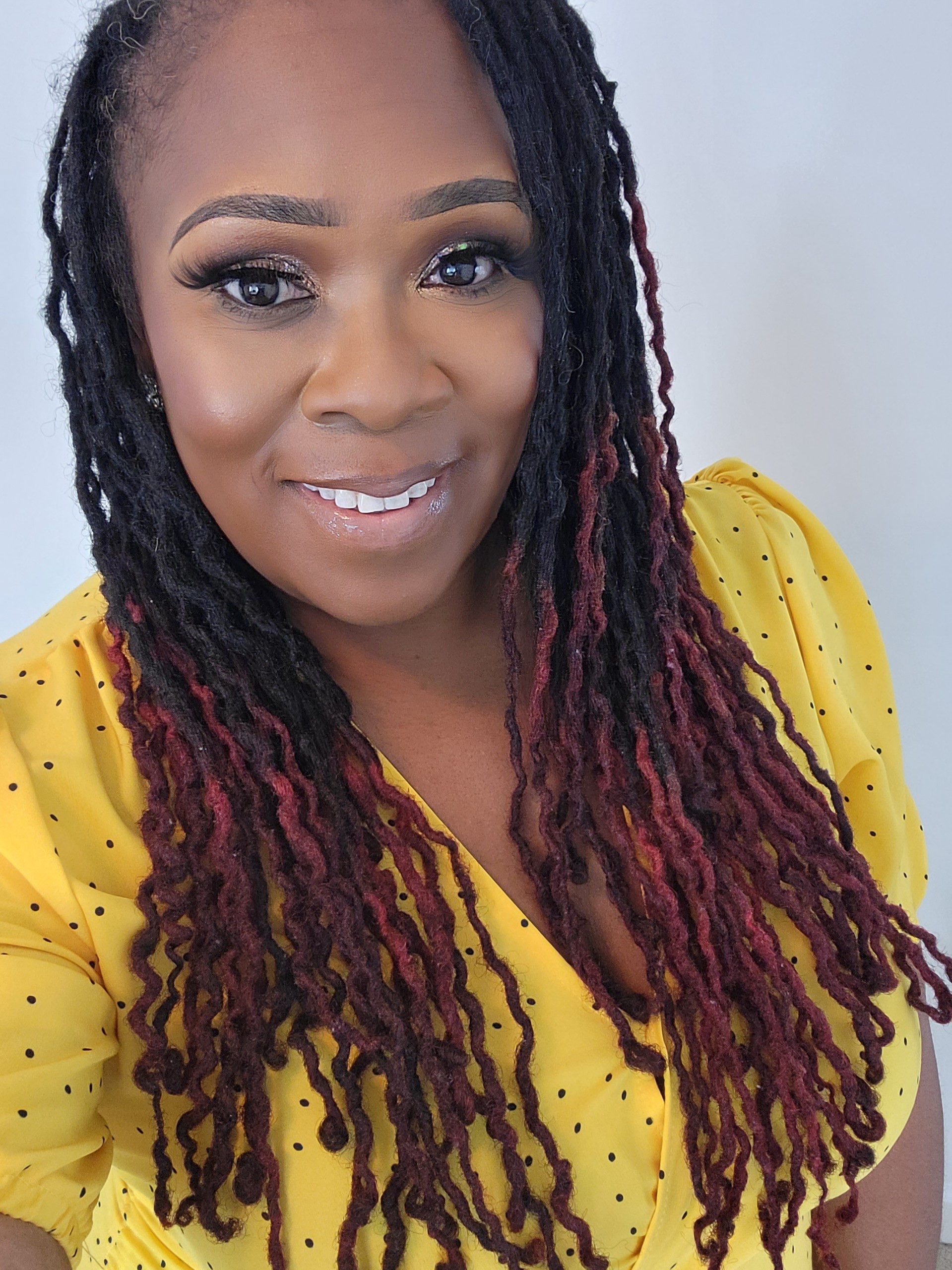 Natashia Williams Financial consultant, Natashia Williams wearing a yellow top.